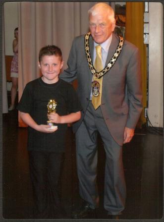 Connah receiving the award from the Mayor of Rhyl